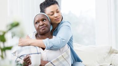 A woman hugging a female relative 