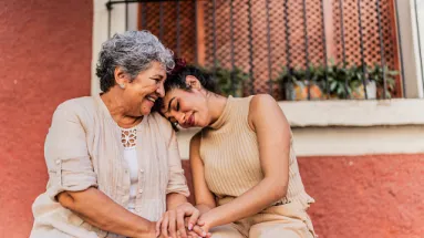 two ladies comforting one another