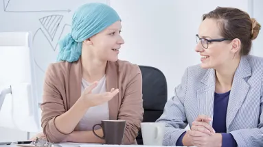 two women talking over coffee