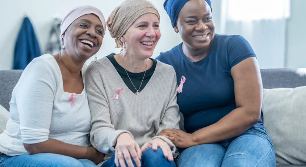 group of women on couch smiling